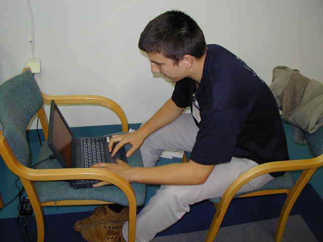 Jure Zakrajsek working on the computer and preparing the IMC2001 homepage updates (credit Javor Kac).