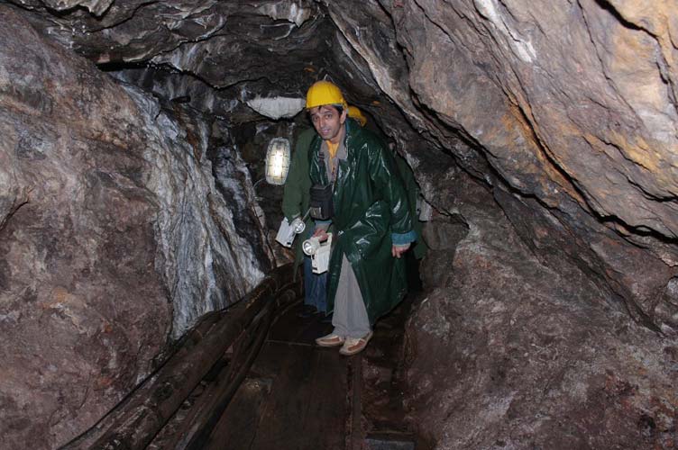 On the walk through the mine we understood why we got a helmet and protection coats: Mihail Robescu in one of the mine galleries (credit Bogdan Cristian Călin).