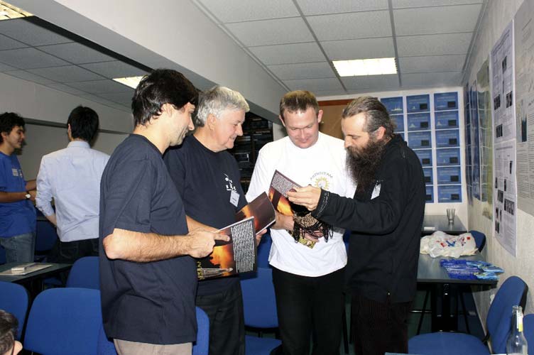 Juraj Toth, Daniel Ocenas and Stanislav Kaniansky receive the astrophoto album of Valentin Grigore (credit Bogdan Cristian Călin).