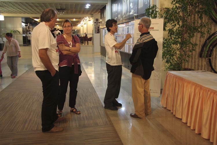 The first evening, Korado Korlević talking to Mihaela Triglav Cekada, Nagatoshi Nogami talking to Stane Slavec, Carina Theiler walks at left (credit Korado Korlević).