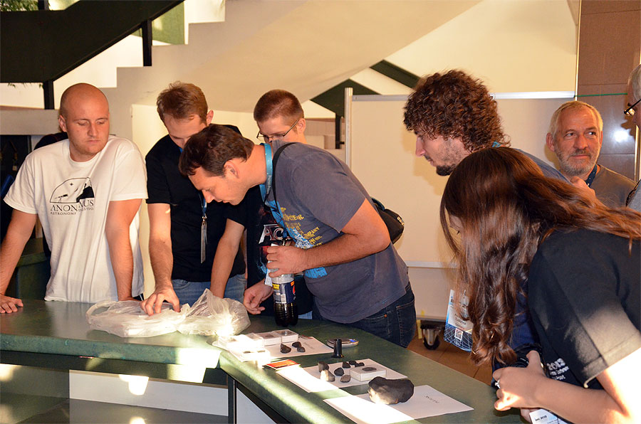 During the poster session: several meteorite samples were exposed. From left to right: Filip Novoselnik, Denis Vida, Alen Žižak, Ivica Skokić, Alex Tudorica, Jürgen Rendtel, André Knöfel and Ivana Barišić. (credit Axel Haas).