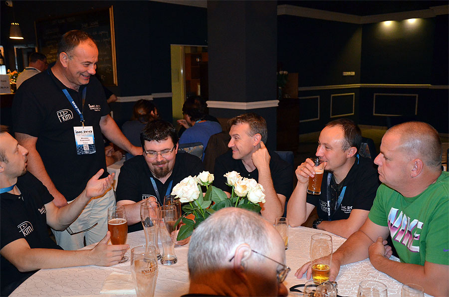 Friday evening socializing: Karol Fietkiewicz, Mirek Krasnowski, Przemysław Żołądek, Zbigniew Tymiński, Marcin Stolarz, Arnold Tukkers and Casper ter Kuile (in front). (credit Axel Haas).