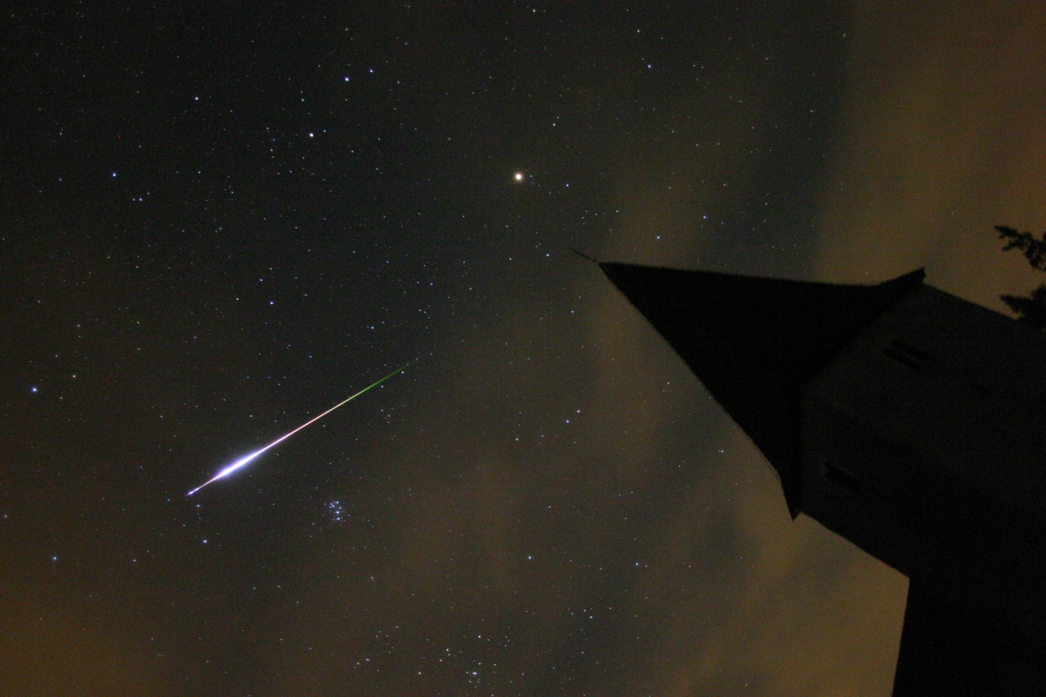 Not a Perseid! A -8 magnitude sporadic fireball in Taurus on August 11, 2005 at 1:59 UT. Photo taken by Peter Atanackov and Simon Krulec from Trije Kralji na Pohorju, Slovenia. Canon EOS 300D, 21-mm f/3.5, ISO 3200, 41 s exposure.